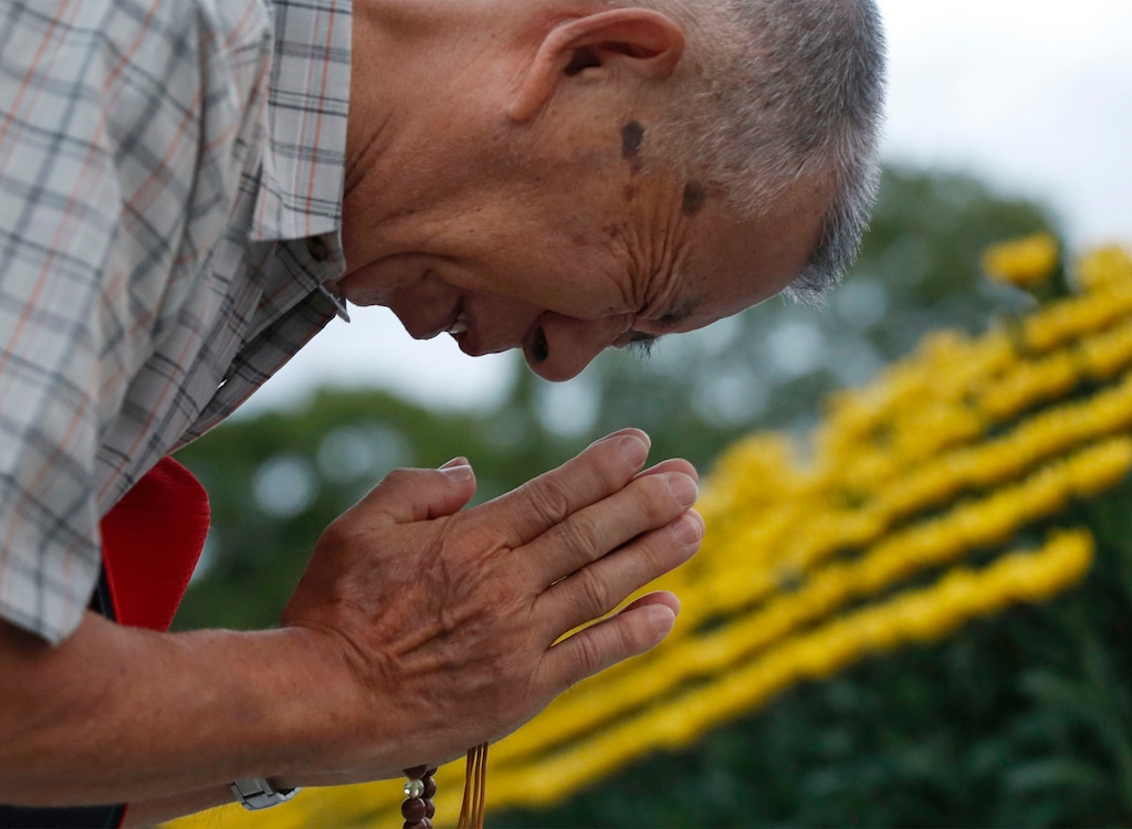 (Kyodo News via AP)

A man prays for the atomic bomb victims in front of the cenotaph at the Hiroshima Peace Memorial Park during a ceremony to mark the 74th anniversary of the bombing, Aug. 6, 2019.