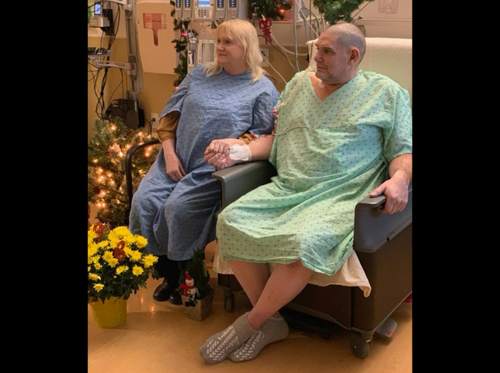 (Photo courtesy of Intermountain Healthcare) Curt Harkins, right, marries Renee' Hall at Intermountain Medical Center in Murray, Wednesday, Dec. 25, 2019. Harkins has been hospitalized since October with heart failure but wanted to tie the knot with his fianc before surgery on Thursday. Caregivers at Intermountain Medical Center helped find a district judge, got them the paperwork, made sure the doctors signed off on it, and decorated the room with Christmas garlands and flowers. Then early this morning, Hall and Harkins put on their hospital gowns and finally tied the knot.