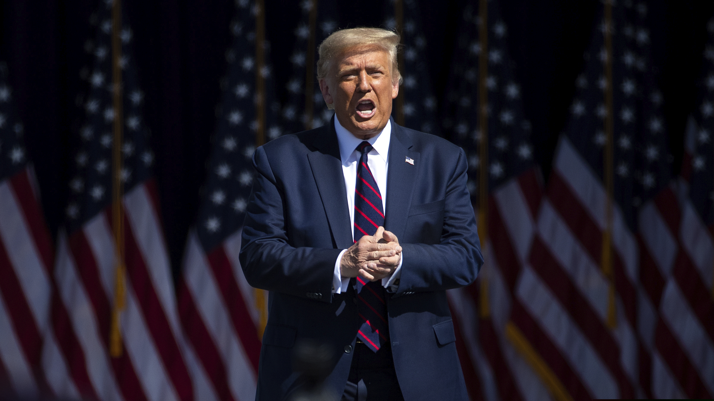(Christopher Dolan | The Times-Tribune via AP) President Donald Trump arrives to speak to a crowd of supporters at Mariotti Building Products in Old Forge, Pa. on Thursday, Aug. 20, 2020.