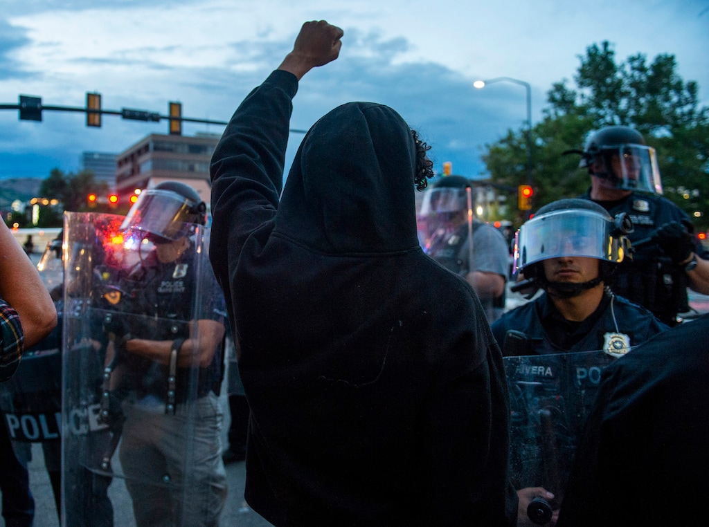 (Rick Egan  |  The Salt Lake Tribune)  Protesters face off with the police in front of the library, Saturday, May 30, 2020.