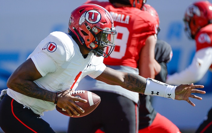 (Francisco Kjolseth  |  The Salt Lake Tribune)  Quarterback Tyler Huntley, #1, fakes a pass as he scrimmages with the team during spring practice at Rice Eccles stadium, the first of two major scrimmages prior to the April 13 Red-White Game. Huntley will face his first big test since he was injured Nov. 3 at Arizona State. 