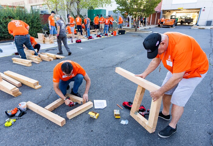 (Rick Egan | The Salt Lake Tribune) More than 600 volunteers, led by Home Depot employees, help spruce up the Sunrise Metro and Freedom Landing apartments in Salt Lake City on Wednesday, Sept. 21, 2022.
