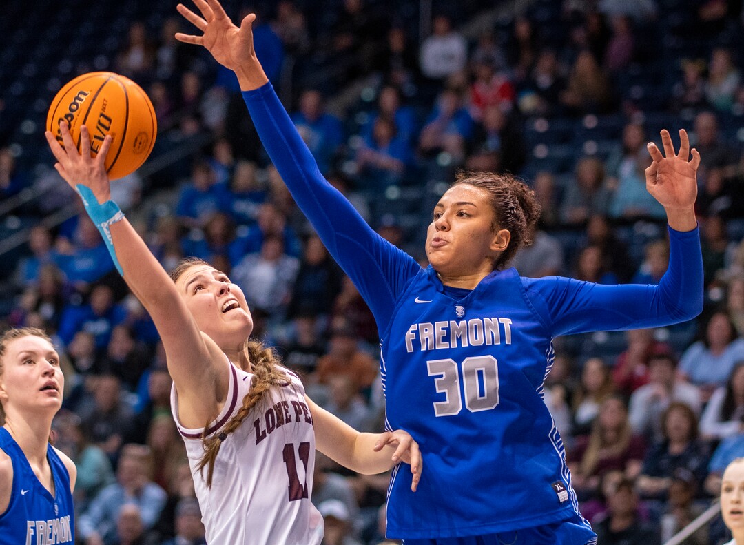 (Rick Egan | The Salt Lake Tribune) Kailey Woolston (11) Lone Peak , as Fremont forward, Timea Gardiner (30) defends for The Silverwolves, in the 6A State Championship game, at the Marriott Center in Provo, on Saturday, March 5, 2022. 
