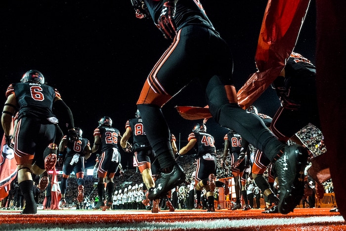(Chris Detrick  |  The Salt Lake Tribune)  Utah Utes run onto the field before the game against UCLA Bruins at Rice-Eccles Stadium Friday, November 3, 2017.   