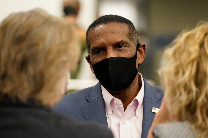 Burgess Owens, Republican candidate in Utah's 4th Congressional District, speaks with people during an Utah Republican election night party Tuesday, Nov. 3, 2020, in Sandy, Utah. (AP Photo/Rick Bowmer)
