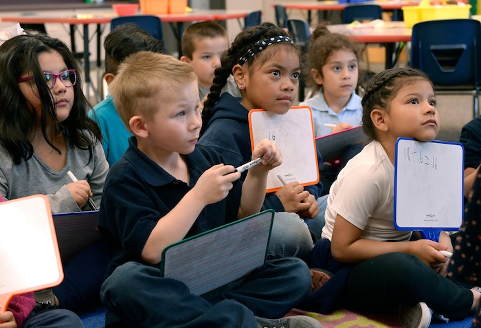 (Al Hartmann | The Salt Lake Tribune) Kindergarten students work out math addition problems on their tablets in Denise White's class at Riley Elementary School in Salt Lake City Tuesday April 10, 2018. Utah’s average scores on the Nation’s Report Card for 2017 have improved from two years ago, but state officials remain concerned that minority and low-income students in the state continue to lag behind their peers.