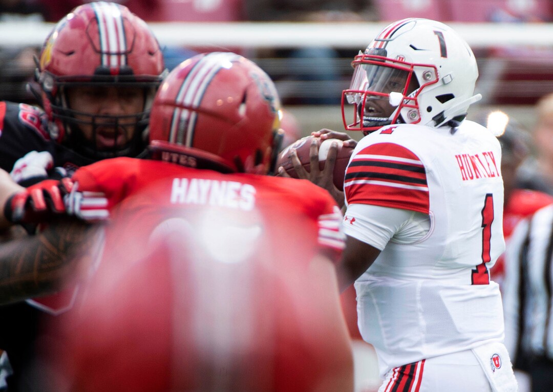 (Rick Egan  |  The Salt Lake Tribune)  Quarterback Tyler Huntley looks for a receiver, in Utah's spring Red-White game at Rice-Eccles Stadium, Saturday, April 13, 2019.