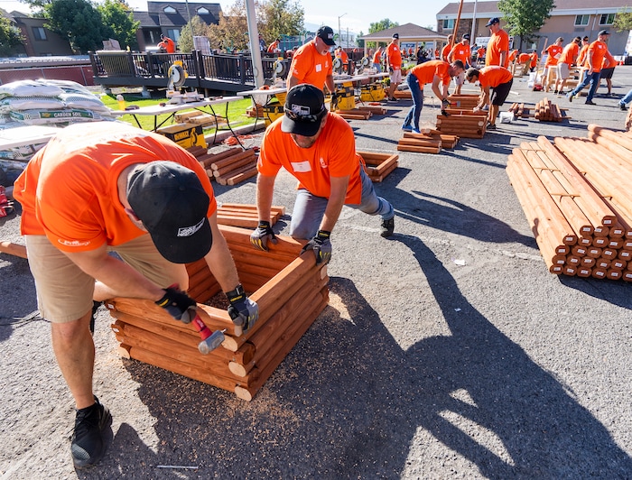 (Rick Egan | The Salt Lake Tribune) More than 600 volunteers, led by Home Depot employees, help spruce up the Sunrise Metro and Freedom Landing apartments in Salt Lake City on Wednesday, Sept. 21, 2022.