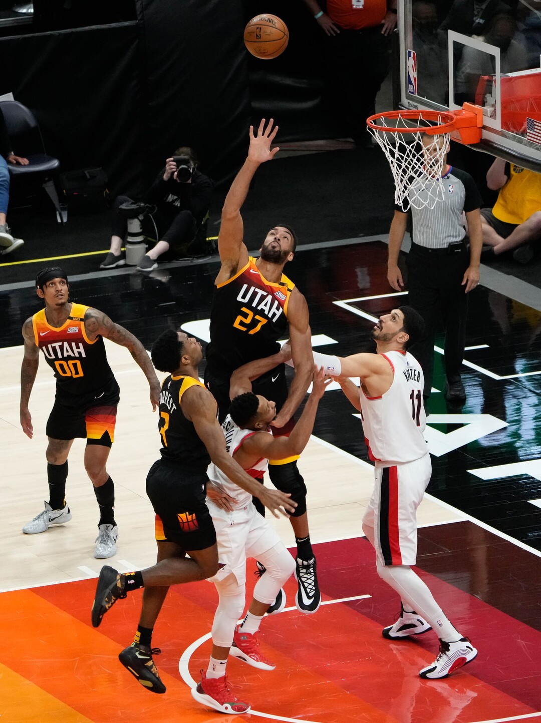 (Francisco Kjolseth | The Salt Lake Tribune) Utah Jazz center Rudy Gobert (27) reaches for a rebounder in NBA action between the Utah Jazz and the Portland Trail Blazers, at Vivint Smart Home Arena, on Wednesday, May 12, 2021.