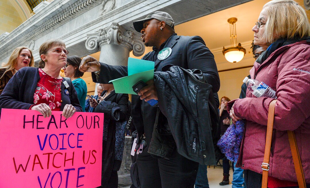 Leah Hogsten  |  The Salt Lake Tribune  l-r Ellie Brownstein, who is in opposition to SB96 and Wiz Rouzard with Americans for Prosperity in favor of SB96 debate for and against in front of the Utah House chamber, Feb. 8, 2019.