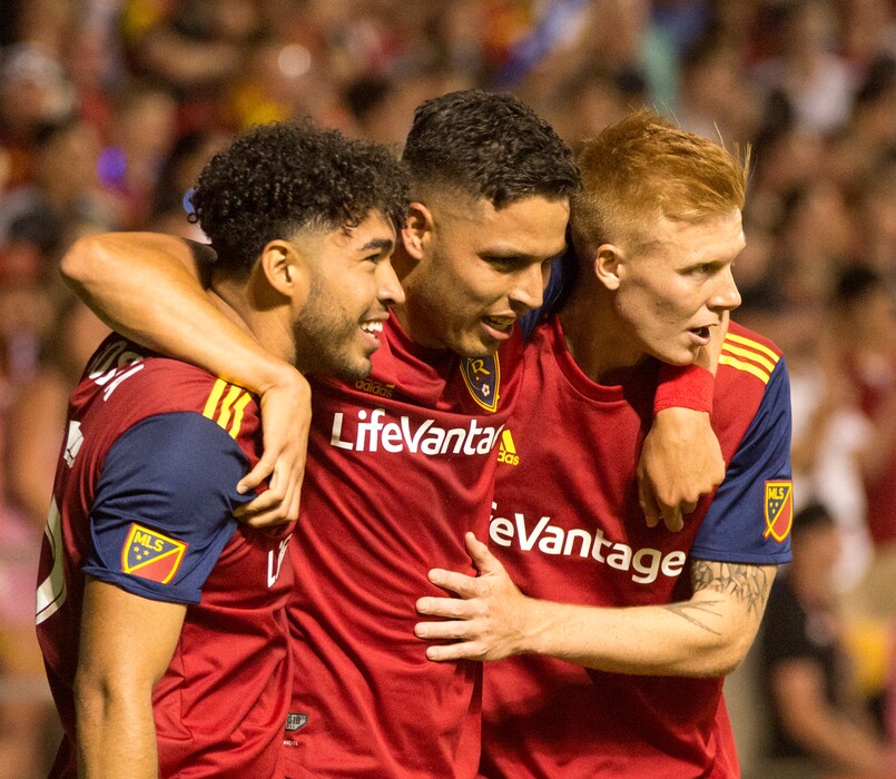 (Rick Egan  |  The Salt Lake Tribune)      Real Salt Lake midfielder Danilo Acosta (25) cand Real Salt Lake defender Justen Glad (15) congratulate Real Salt Lake midfielder Luis Silva (20) after he scored a goal giving Real Salt Lake a 4-2 lead, in MLS soccer action between Real Salt Lake and Sporting Kansas City at Rio Tinto Stadium, Wednesday, July 4, 2018.