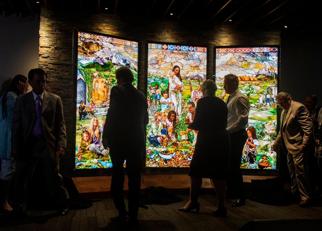 (Rick Egan  |  The Salt Lake Tribune)     Dignitaries unveil the first three of its "7 Pillars" windows, created by artist Tom Holdman, during a Roots of Humanity Foundation ceremony, at the 100 Club room at the Vivint Smart Home Arena, Sunday, Aug. 25, 2019.