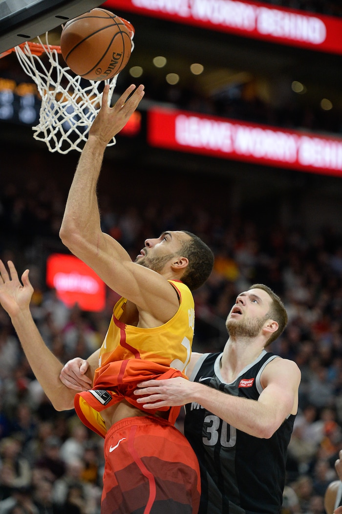 (Francisco Kjolseth  |  The Salt Lake Tribune)  Utah Jazz center Rudy Gobert (27) is pressured by Detroit Pistons forward Jon Leuer (30) in the first half of their NBA game at Vivint Smart Home Arena Monday, Jan. 14, 2019, in Salt Lake City.