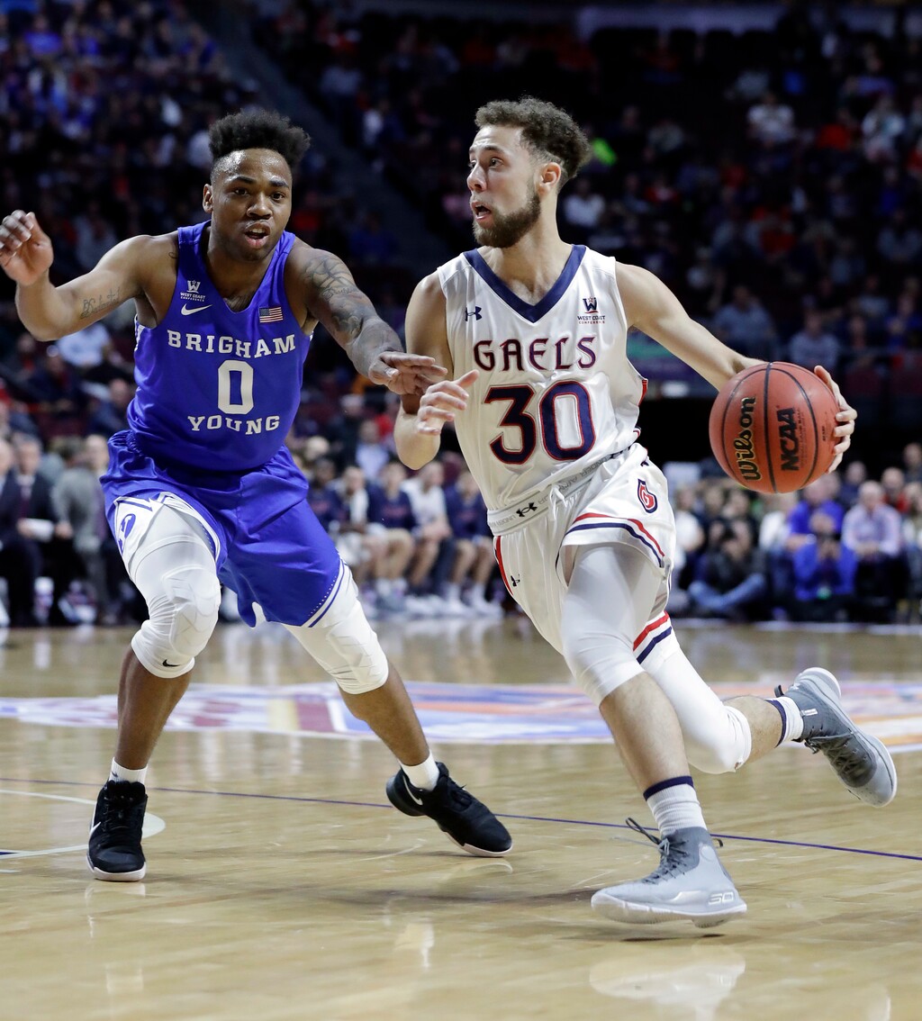 Jordan Ford of Saint Mary's, shown here driving against BYU's Jahshire Hardnett, is one of the top scorers in the West Coast Conference and will face the Cougars on Thursday night in Provo. (AP Photo/Isaac Brekken)