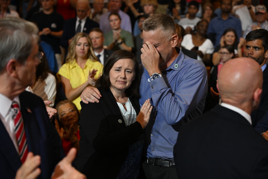 (Kenny Holston | The New York Times) Shari and Stephen Feehan, the parents of U.S. Army 1st Lt. Tyler James Feehan, react as they are recognized by President Donald Trump during a speech at Wheeler High School in Marietta, Ga., on July 22, 2026.