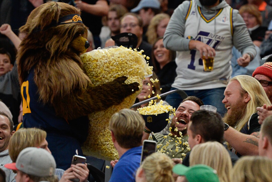 (Francisco Kjolseth  |  The Salt Lake Tribune)  Bear dishes out the popcorn in peoples hats as the Utah Jazz host the New Orleans Pelicans in their NBA basketball game at Vivint Smart Home Arena in Salt Lake City on Sat. Nov. 23, 2019.