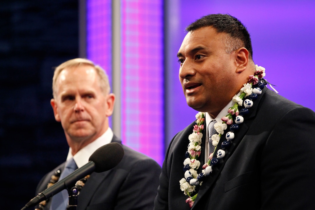 Kalani Sitake, right, is introduced as the new football head coach for Brigham Young University during a news conference, Monday, Dec. 21, 2015 at the BYU Broadcasting Building in Provo, Utah. (Sammy Jo Hester/The Daily Herald via AP) MANDATORY CREDIT 