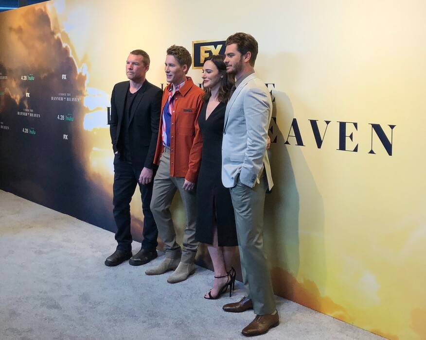 (Scott D. Pierce | The Salt Lake Tribune) Actor Sam Worthington, writer-producer Dustin Lance Black, actor Tyner Rushing and actor Andrew Garfield pose for photos at a premiere event for the FX/Hulu miniseries "Under the Banner of Heaven," at Salt Lake City's Broadway Centre Cinemas on Monday, April 25, 2022.