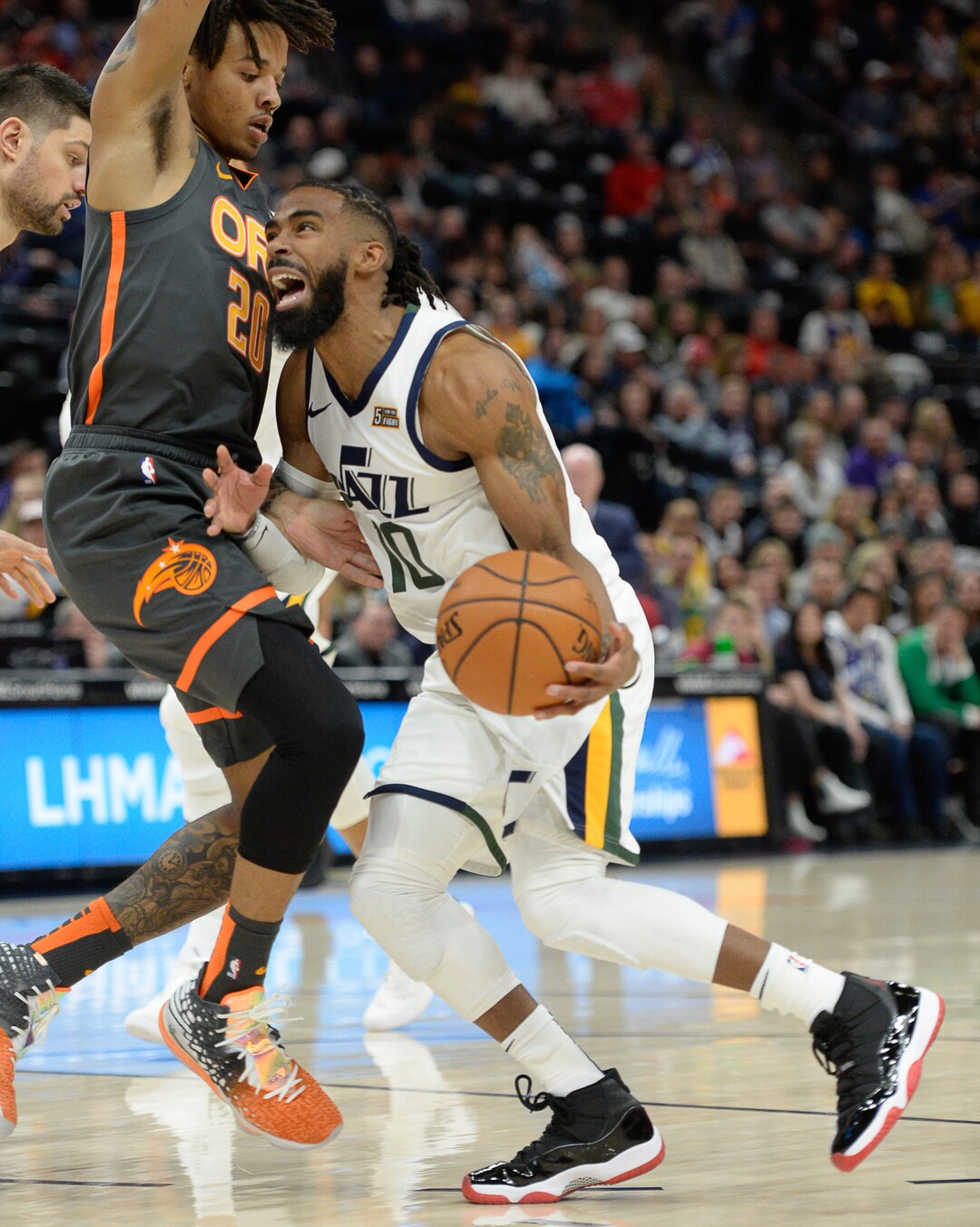 (Francisco Kjolseth  |  The Salt Lake Tribune) Orlando Magic guard Markelle Fultz (20) pressures Utah Jazz guard Mike Conley (10) as the Utah Jazz host the Orlando Magic in their NBA basketball game at Vivint Smart Home Arena in Salt Lake City on Tuesday. Dec. 17, 2019.