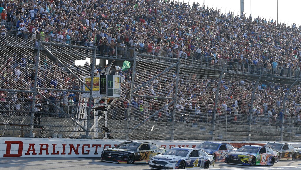 Kevin Harvick (4) leads the field past the green flag at the start of a NASCAR Monster Cup auto race at Darlington Raceway, Sunday, Sept. 3, 2017, in Darlington, S.C. (AP Photo/Terry Renna)