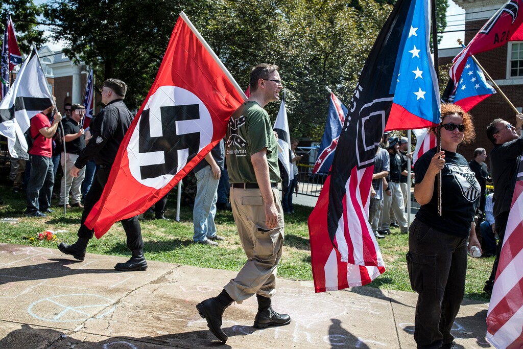 FILE Neo-Nazi demonstrators at the Unite the Right rally in Charlottesville, Va., on Aug. 12, 2017. After former President Donald Trump dined with the performer Kanye West and with Nick Fuentes, an outspoken antisemite and Holocaust denier, even some of his staunchest supporters said they can no longer ignore the abetting of bigotry by the nominal leader of the Republican Party. (Edu Bayer/The New York Times)