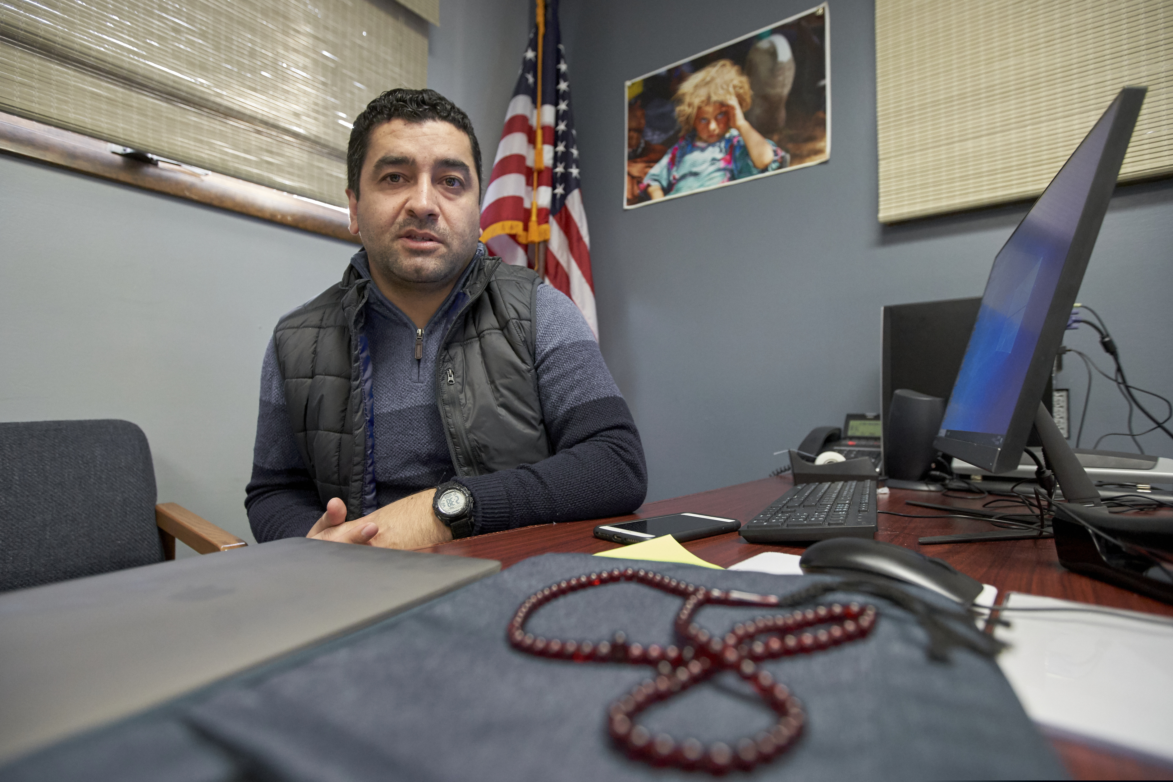 (Nati Harnik | AP) Hatim Ido is seen at the Yazidi community center in Lincoln, Neb., Dec. 19, 2019. Gov. Pete Ricketts announced he would continue to allow refugees to settle in Nebraska, and in an open letter praised President Trump for adding new security layers to the vetting process. The uncertainty prior to that announcement was a major worry for Hatim Ido, a graduate student in Lincoln, Neb., who fled from Iraq to the United States after working as a translator for the U.S. Army.