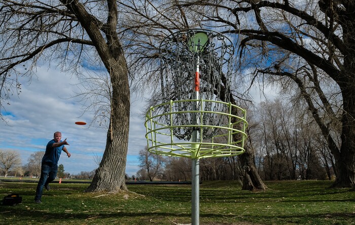 (Francisco Kjolseth  |  The Salt Lake Tribune)  Long time disc golfer Nathan Ottesen of Orem tries out the Roots Disc Golf Course in the Rose Park neighborhood, site of one of the original disc golf courses in Utah before becoming a ball golf course for nearly 20 years. PGA Tour golfer Tony Finau grew up playing the Jordan River Par-3 course that has been converted back to a disc golf venue.