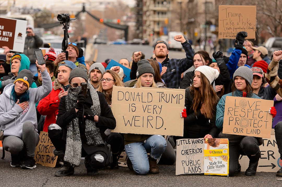 (Trent Nelson | The Salt Lake Tribune)  Protesters block off an intersection downtown after a rally against a visit by President Donald Trump, Monday December 4, 2017.