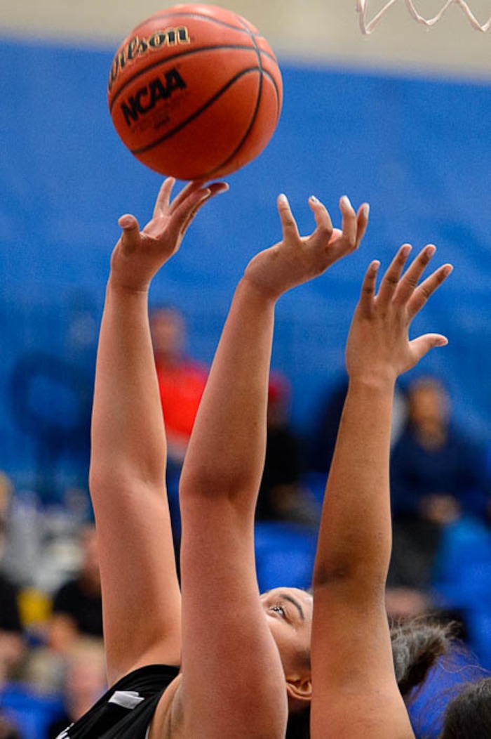 (Trent Nelson | The Salt Lake Tribune)  Highland's Lana Olevao (33) reaches up for the ball as Woods Cross faces Highland in the 5A High School Girls' Basketball Tournament at SLCC in Taylorsville, Wednesday Feb. 21, 2018.