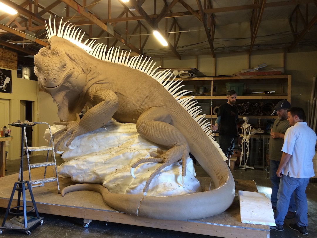 (Courtesy Red Iguana) Forming the iguana with clay, during the early stages of the project.