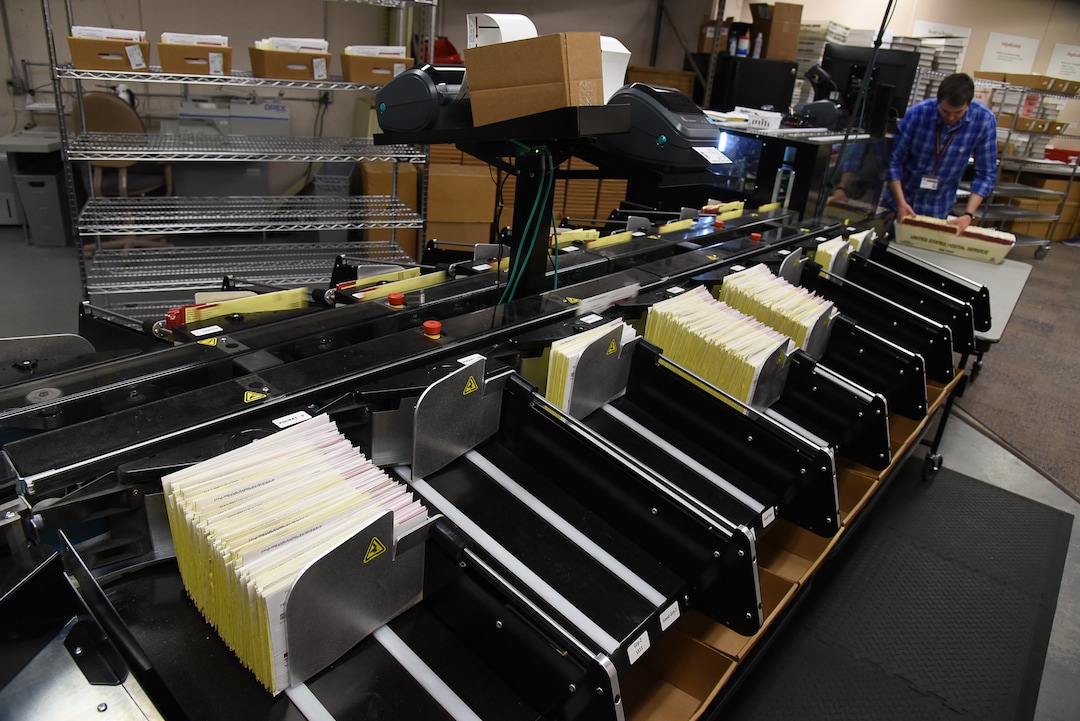 (Francisco Kjolseth  |  The Salt Lake Tribune)  Mailed in ballots speed through an Agilis ballot sorting machine that can process up to 19,000 ballots an hour, taking pictures of the signature on the exposed affidavit and reading the bar code that shows a voter has returned their ballot for immediate confirmation at the Ballot Center in Salt Lake on Tuesday, Oct. 301, 2018. Turnout numbers from the State Elections Office showed 359,219 people out of 1,390,679 active Utah voters have already cast their ballots as of Tuesday morning. Turnout numbers from the State Elections Office showed 359,219 people out of 1,390,679 active Utah voters have already cast their ballots as of Tuesday morning. Ten Salt Lake County early voting locations will open on Wednesday, but 1,059 voters have already taken advantage of voting at the Salt Lake County government offices. While many have already cast their ballots, there are some Utahns who haven't received theirs in the mail yet, which may create obstacles for them to vote.