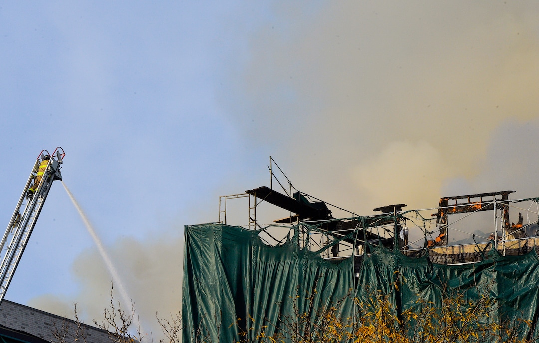(Chris Samuels | The Salt Lake Tribune) Emergency crews continue to respond to a four-alarm fire in a new construction of apartment residences in Sugar House, Wednesday, Oct. 26, 2022.
