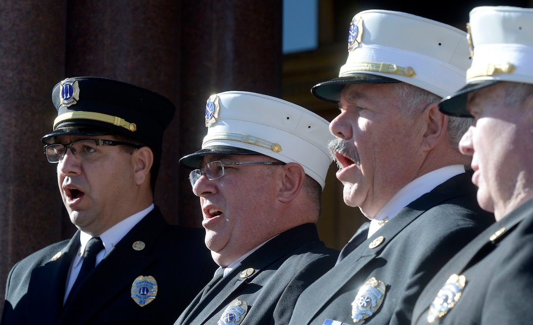 (Al Hartmann  |  The Salt Lake Tribune) 	Salt Lake City Fire Dept. Choir sings the national Anthem for swearing in ceremony for  re-elected City Council Members James Rogers and Erin Mendenhall, and two new Council Members, Chris Wharton and Amy Fowler outside the City-County Building Tuesday Jan. 2. 