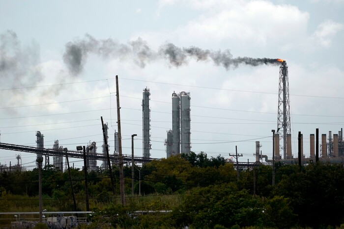 Winds blow the smoke from a refinery, Wednesday, Aug. 26, 2020, in Port Arthur, Texas. The energy industry is bracing for catastrophic storm surges and winds as Hurricane Laura cuts a dangerous path toward the coastlines of Texas and Louisiana.(AP Photo/Eric Gay)