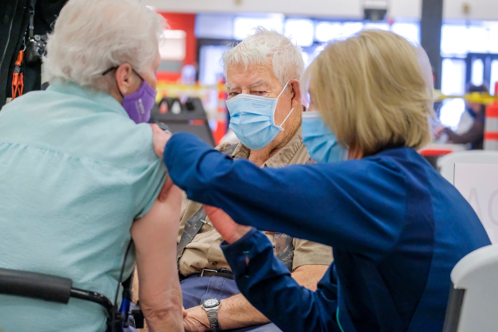 (Leah Hogsten | The Salt Lake Tribune)  Aaron Dickey, 91, watches his wife Marion Dickey, 83, as the two received their second COVID-19 vaccine from Utah County Health Department nurse Janeen Hamel in Spanish Fork, Mar. 25, 2021.