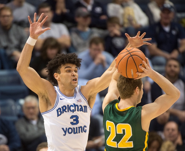 (Rick Egan  |  The Salt Lake Tribune)     Brigham Young Cougars guard Elijah Bryant (3) defends as San Francisco Dons forward Chase Foster (22) controls the ball,in basketball action at the Marriott Center, Saturday, February 10, 2018.