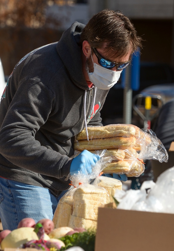 (Leah Hogsten  |  The Salt Lake Tribune)  Snowbird employees handed out over 10,000 pounds of perishable items from the ski resort's restaurants and stores to their workforce, March 21, 2020. The food included milk, eggs, bread, cheeses, every kind of herb, vegetable and fruit, including kumquats and lemon grass, and was given to Snowbird employees on a first-come, first-served basis.