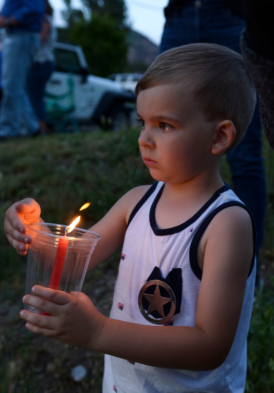 (Leah Hogsten  |  The Salt Lake Tribune) Friends and supporters lined the neighborhood of Officer Nate Lyday's childhood home on Custer Avenue in Ogden prior to the Memorial Procession and Community Vigil in honor of Lyday's life. The procession made its way through five other Ogden landmarks before ending at Lindquist Field.