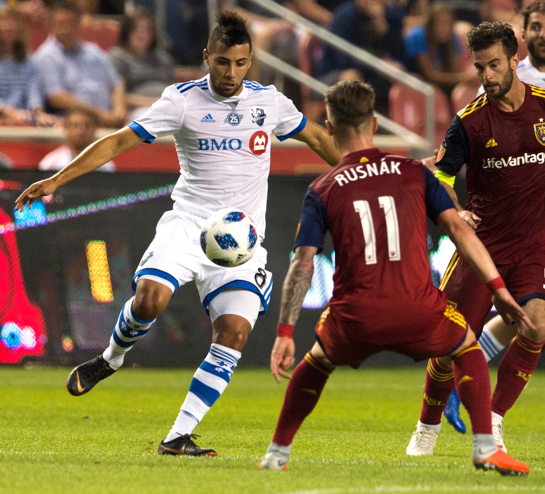 Montreal Impact midfielder Saphir Taider (8) kicks the ball as Real Salt Lake midfielder Albert Rusnak (11) defends in MLS soccer game action in Sandy, Utah, Saturday, Aug. 11, 2018. (Rick Egan/The Salt Lake Tribune via AP)