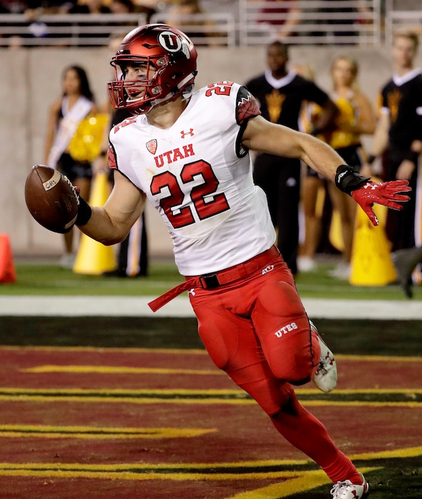 Utah defensive back Chase Hansen scores a touchdown after an interception against Arizona State during the second half of an NCAA college football game, Thursday, Nov. 10, 2016, in Tempe, Ariz. (AP Photo/Matt York)