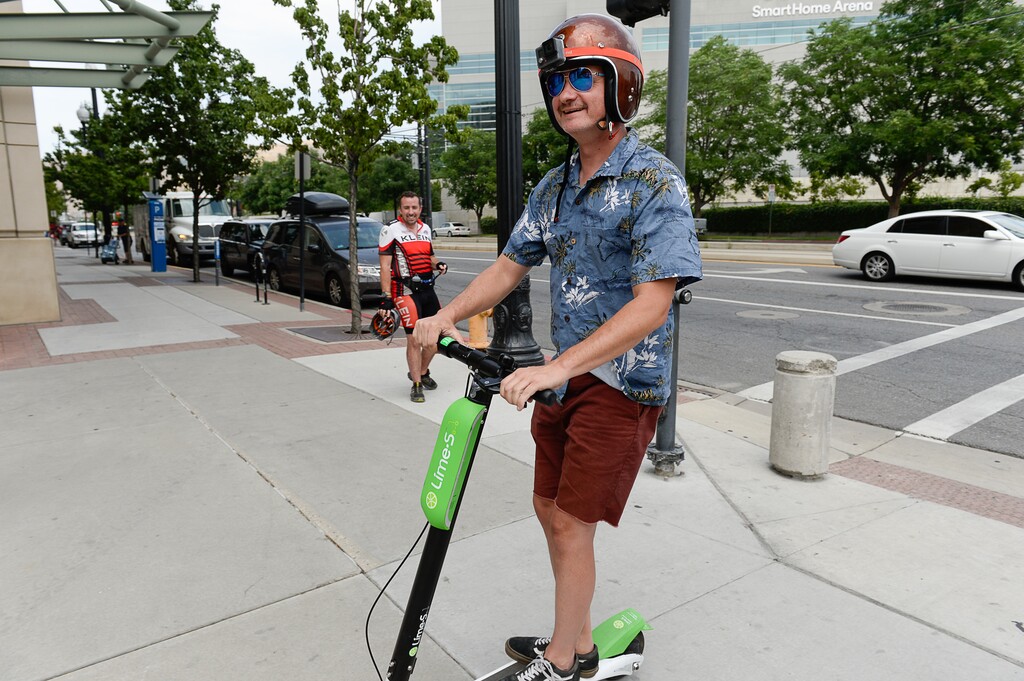 (Francisco Kjolseth | The Salt Lake Tribune) Salt Lake Tribune columnist Robert Gehrke finishes his race against colleagues during a downtown transportation race from Library Square to the Tribune building at the Gateway on Thursday, Aug. 2, 2018. Modes of transportation included, rentable electric scooters, Green Bike, TRAX, Lyft, and walking.