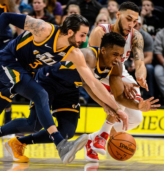 (Trent Nelson | The Salt Lake Tribune)  Utah Jazz guard Ricky Rubio (3), Utah Jazz guard Donovan Mitchell (45) and Chicago Bulls forward Denzel Valentine (45) dive for a loose ball as the Utah Jazz host the Chicago Bulls, NBA basketball in Salt Lake City Wednesday November 22, 2017.