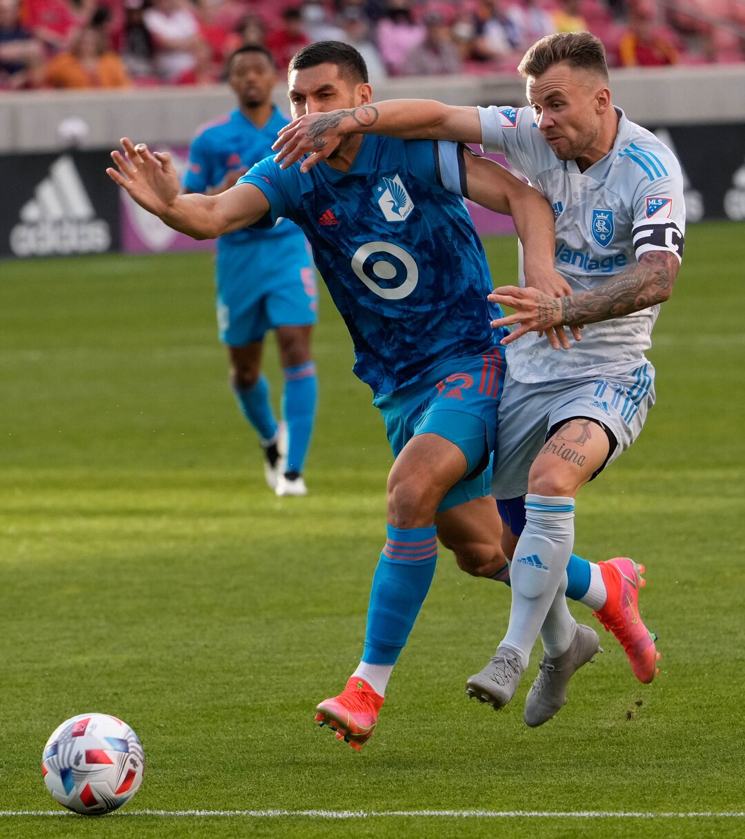 (Francisco Kjolseth | The Salt Lake Tribune) Minnesota United defender Michael Boxall (15) and Real Salt Lake midfielder Albert Rusnak (11) fight for the ball in MLS action between Real Salt Lake and Minnesota United FC at Rio Tinto Stadium in Sandy, on Saturday, May 29, 2021.