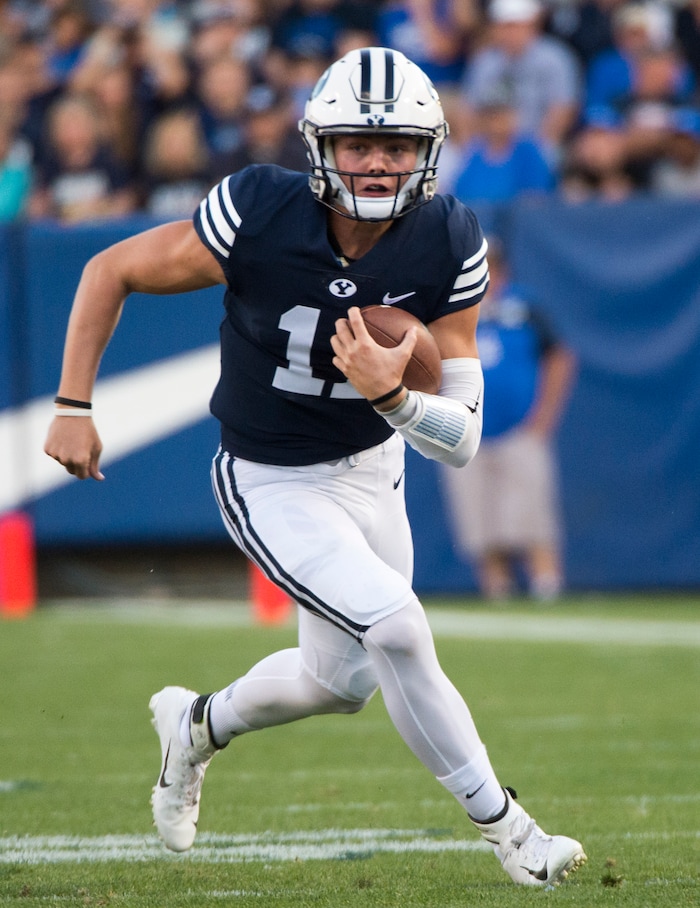 (Rick Egan  |  The Salt Lake Tribune)    Brigham Young Cougars quarterback Zach Wilson (11) looks at the clock before taking a knee on the 5 hardline instead of trying to score in the final minute of the game as the Brigham Young Cougars led the McNeese State Cowboys 30-3, at Lavell Edwards Stadium, Saturday, Sept. 22, 2018.


