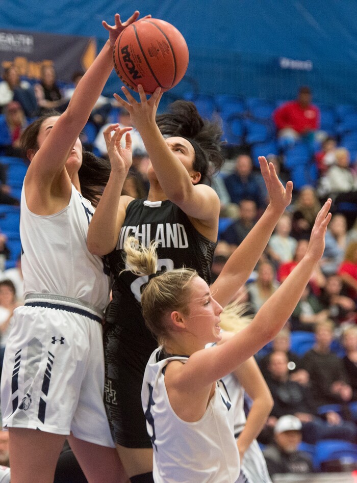 (Rick Egan | The Salt Lake Tribune) Corner Canyon Chargers Angela Vaifanua blocks a shot by Highand High Rams Kaija Glasker (22) in Class 5A women's basketball playoff game between Corner Canyon and Highland, Monday, Feb. 19, 2018.