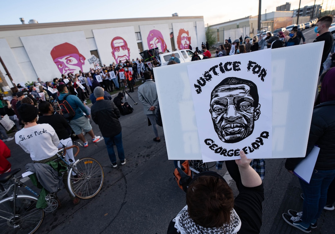 (Francisco Kjolseth  | The Salt Lake Tribune) People gather at the murals of people killed by police in Salt Lake City on Tuesday, April 20, 2021, following the guilty verdict on all three counts in the murder trial of former Minneapolis police Officer Derek Chauvin in the death of George Floyd.