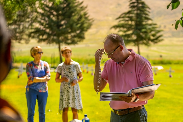 (Trent Nelson  |  The Salt Lake Tribune) Acolyte Chris Kennedy leads Rosary prayers at the Abbey of the Holy Trinity in Huntsville during a gathering to celebrate 75 years since its founding on Sunday, July 10, 2022.
