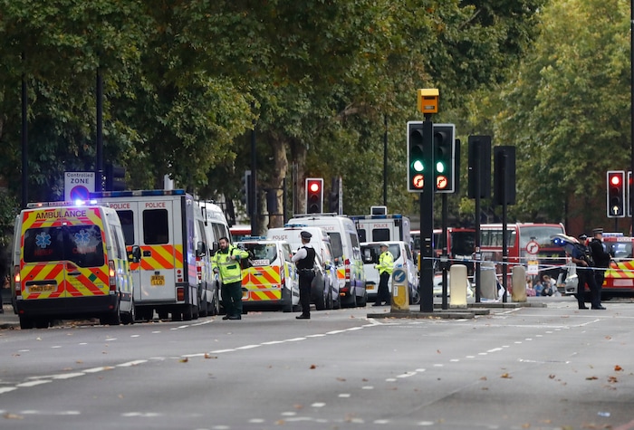 Britain's police and emergency services at the scene of an incident in central London, Saturday, Oct. 7, 2017. London police say emergency services are outside the Natural History Museum in London after a car struck pedestrians. (AP Photo/Kirsty Wigglesworth)
