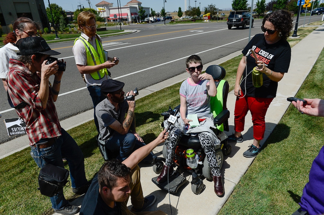 (Francisco Kjolseth  |  The Salt Lake Tribune)  Activists Psarah Johnson talks about locking herself alongside other activists in the lobby of a private prison company with contracts to hold undocumented immigrants on Thursday, July 12, 2018, at the headquarters of Management and Training Corporation in Centerville. Johnson was released after being charged with disorderly conduct, trespassing and resisting arrest and believes she was let go while others were arrested because "the police is not ADA compliant." 