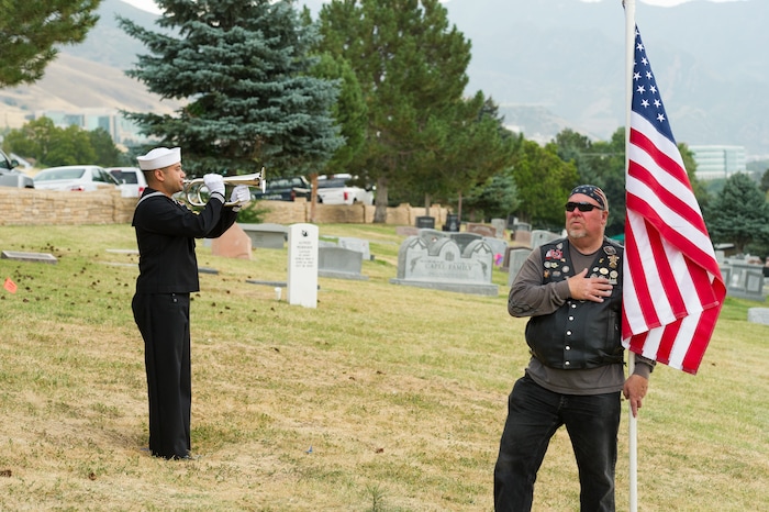 (Alex Gallivan  |  Special to The Tribune) Marine Pfc. Robert K. Holmes, who died 77 years ago aboard the USS Oklahoma during the attack on Pearl Harbor, is laid to rest in the Salt Lake City Cemetery, Monday, Aug. 20, 2018.